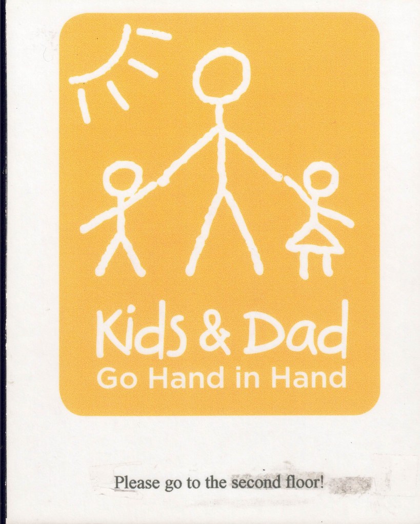 Kids and Dad sign from their physical office
