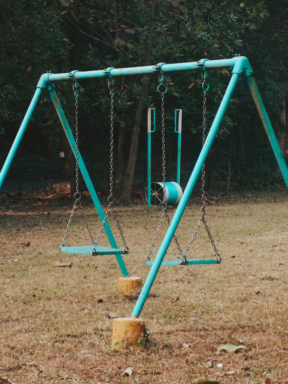 two empty park swings