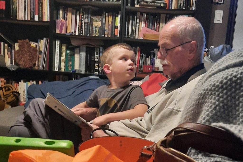Barry reading to his grandson